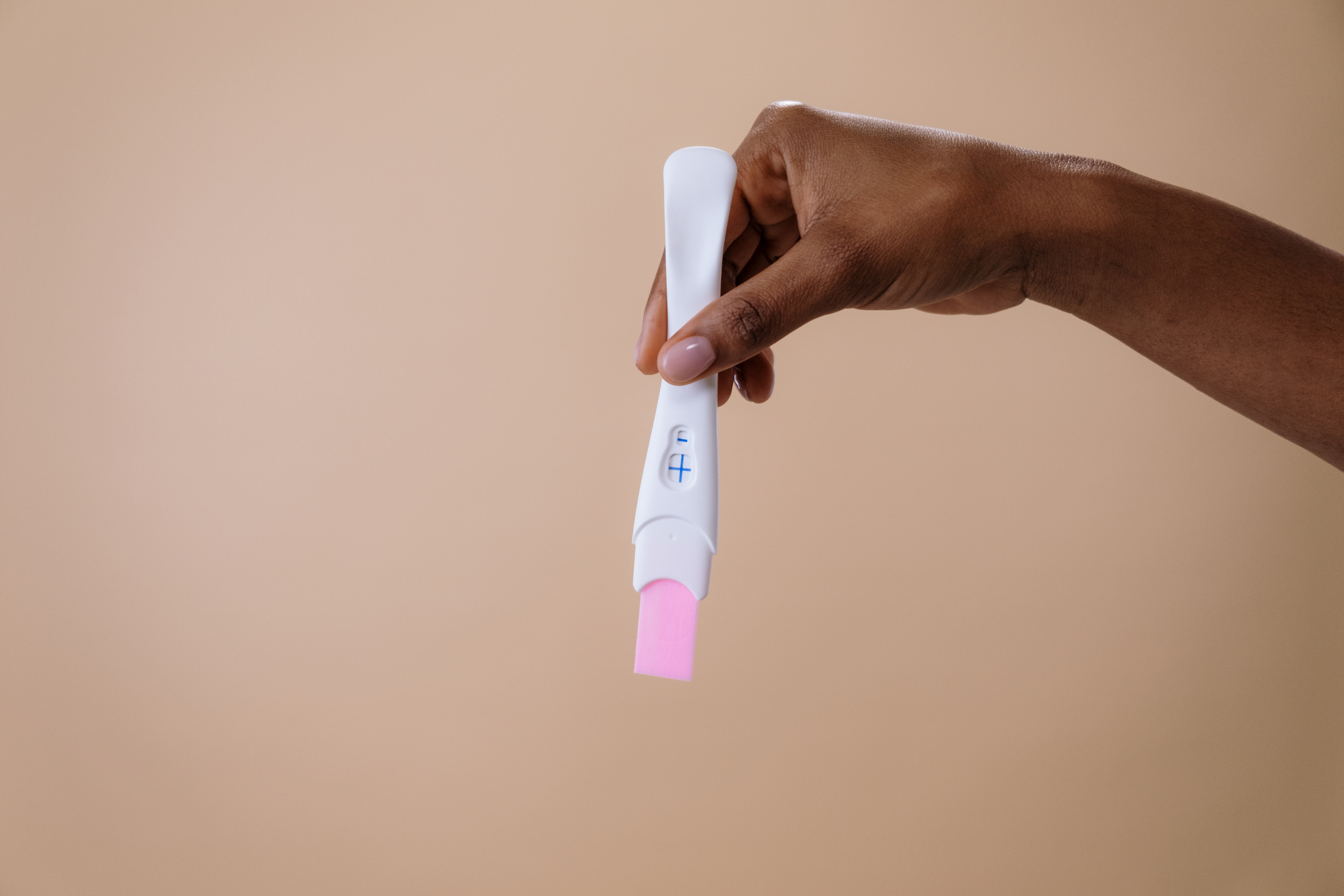 Person Holding a Pregnancy Test