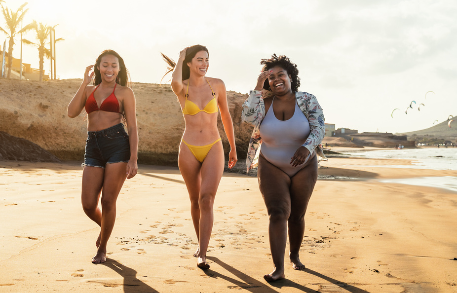 Multiracial and Multisize Women Having Fun at the Beach